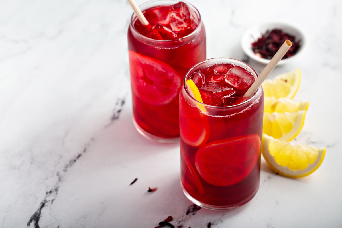 Hibiscus Lemon Lift iced tea served cold with ice in a glass