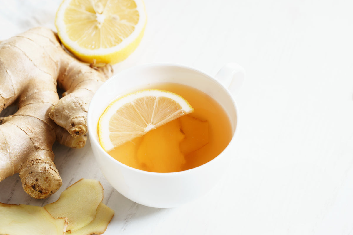 Fresh ginger tea with lemon slice in a cup
