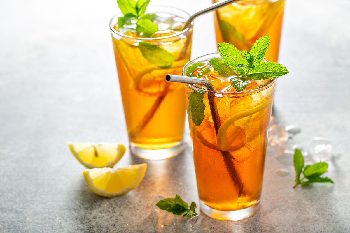 Iced tea with lemon and mint cold refreshing summer drink with ice